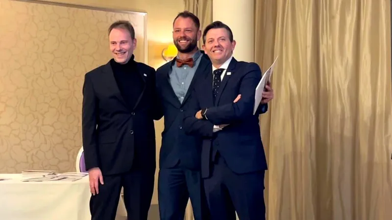 Dr Migael Pohl with two colleagues at a postgraduate qualification ceremony